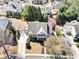 Aerial view of a home showcasing its landscaped yard, long driveway, and neighborhood setting at 404 N Cascades Cir, Canton, GA 30114