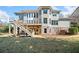 Backyard featuring a multi-level deck, stairs, and a well-maintained lawn at 404 N Cascades Cir, Canton, GA 30114