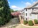 Large backyard featuring a wooden deck, green lawn, and mature trees offering privacy at 404 N Cascades Cir, Canton, GA 30114