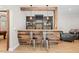 Basement wet bar with custom wood countertop and barstool seating at 404 N Cascades Cir, Canton, GA 30114