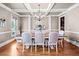 Formal dining room with hardwood floors, decorative lighting, and seating for eight at 404 N Cascades Cir, Canton, GA 30114