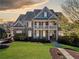 Charming two-story home with a welcoming front porch and manicured lawn at 404 N Cascades Cir, Canton, GA 30114