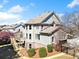 Two-story home with gray siding, brick foundation, and a wooden deck overlooking the backyard at 404 N Cascades Cir, Canton, GA 30114