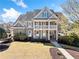 Beautiful two-story home featuring a classic brick facade and a spacious front yard at 404 N Cascades Cir, Canton, GA 30114