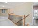 Upstairs hallway features neutral paint and carpet at 404 N Cascades Cir, Canton, GA 30114
