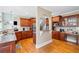 Bright kitchen featuring hardwood floors, granite countertops, and wood cabinetry at 404 N Cascades Cir, Canton, GA 30114