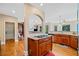 Chef's kitchen with stainless appliances, granite countertops and wood floors at 404 N Cascades Cir, Canton, GA 30114