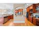 A bright kitchen featuring hardwood floors, stainless appliances, and wood cabinetry at 404 N Cascades Cir, Canton, GA 30114