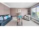 Comfortable living room featuring a large window and a mix of seating options at 404 N Cascades Cir, Canton, GA 30114