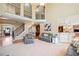 Inviting living room with high ceilings, staircase, and comfortable seating at 404 N Cascades Cir, Canton, GA 30114