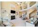 Expansive living room with fireplace, TV, and staircase to upper level at 404 N Cascades Cir, Canton, GA 30114