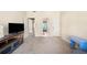 Open-concept living room with a large TV, stylish media console, and comfortable seating area at 404 N Cascades Cir, Canton, GA 30114