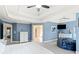 Spacious main bedroom with blue walls, ceiling fan, and plenty of natural light at 404 N Cascades Cir, Canton, GA 30114