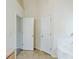 Bathroom with separate tub and shower area with tile surround, offering space and functionality at 445 Skif Pond Ct, Atlanta, GA 30349