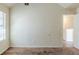 Empty bedroom features vaulted ceiling, neutral paint and carpet, and window at 445 Skif Pond Ct, Atlanta, GA 30349