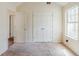 This bedroom has an egress window and closet with double doors and needs a little TLC at 445 Skif Pond Ct, Atlanta, GA 30349