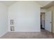Bedroom with vaulted ceilings, neutral carpet, and an alcove for media connections at 445 Skif Pond Ct, Atlanta, GA 30349