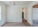 Bright dining room with classic wainscoting and a view into the living area at 445 Skif Pond Ct, Atlanta, GA 30349