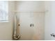 A simple laundry room setup with a utility sink hookups and metal shelving installed at 445 Skif Pond Ct, Atlanta, GA 30349