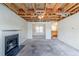 Living room with fireplace, view of dining area, and unfinished ceiling at 445 Skif Pond Ct, Atlanta, GA 30349