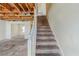 Staircase leading to the upper level; shows access to lower level living spaces at 445 Skif Pond Ct, Atlanta, GA 30349
