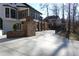 Expansive backyard with a large patio, brick fireplace, and ample space for outdoor activities and relaxation at 4960 Trevino Cir, Duluth, GA 30096
