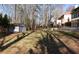 Large backyard with a storage shed and a newly built patio, ready for outdoor entertaining at 4960 Trevino Cir, Duluth, GA 30096
