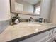 Bathroom featuring white vanity with gray countertop and decorative accents at 4960 Trevino Cir, Duluth, GA 30096