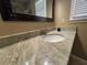 Bathroom featuring a large vanity with countertop and decorative dark mirror at 4960 Trevino Cir, Duluth, GA 30096