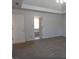 Bedroom featuring neutral paint, carpet, and a doorway leading to the bathroom at 4960 Trevino Cir, Duluth, GA 30096