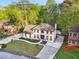 Two-story home featuring great landscaping, an automatic gate, and a large concrete driveway at 4960 Trevino Cir, Duluth, GA 30096