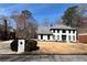Beautiful two-story home with white exterior, dark trim, a spacious front yard, and adjacent mailbox at 4960 Trevino Cir, Duluth, GA 30096
