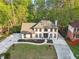 Two-story home with a well manicured lawn, beautiful landscaping, and a huge concrete driveway at 4960 Trevino Cir, Duluth, GA 30096
