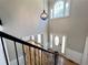 Bright and airy two-story foyer with hardwood floors, a decorative chandelier, and a front door with sidelights at 4960 Trevino Cir, Duluth, GA 30096