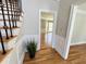 Inviting foyer with hardwood floors, decorative molding, and an open doorway to the living area at 4960 Trevino Cir, Duluth, GA 30096