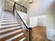 Welcoming foyer with beautiful hardwood floors, staircase and views to the living room at 4960 Trevino Cir, Duluth, GA 30096