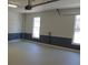A clean, bright garage featuring fresh paint, paneled walls, and windows at 4960 Trevino Cir, Duluth, GA 30096