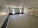 Spacious garage with an insulated door, lots of room for storage, and two windows for natural light at 4960 Trevino Cir, Duluth, GA 30096