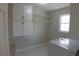 Laundry room featuring tile flooring, overhead cabinets and a utility sink at 4960 Trevino Cir, Duluth, GA 30096