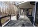 Inviting porch with black railings and a private wooded view at 4960 Trevino Cir, Duluth, GA 30096