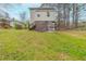 Large backyard featuring a lush green lawn and mature trees at 202 Nathan Sw Rd, Atlanta, GA 30331
