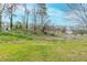 Overgrown backyard surrounded by trees at 202 Nathan Sw Rd, Atlanta, GA 30331