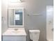 Bathroom featuring a white vanity, a toilet, and tiled walls at 202 Nathan Sw Rd, Atlanta, GA 30331