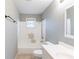 Bright bathroom with a white tiled shower and a modern sink at 202 Nathan Sw Rd, Atlanta, GA 30331