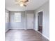 The bedroom is light and airy with wood-look floors at 202 Nathan Sw Rd, Atlanta, GA 30331