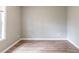 Bedroom has a gray walls and wood-look floors at 202 Nathan Sw Rd, Atlanta, GA 30331