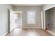 Bright bedroom with wood flooring, natural light and a closet, providing a comfortable private space at 202 Nathan Sw Rd, Atlanta, GA 30331