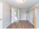 Bedroom featuring wood-look floors and open closet space at 202 Nathan Sw Rd, Atlanta, GA 30331