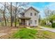 Charming two-story home with a front porch, driveway, and natural landscaping, perfect for suburban living at 202 Nathan Sw Rd, Atlanta, GA 30331