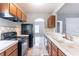 Cozy kitchen featuring tile floors, cabinets, and essential appliances, perfect for home-cooked meals at 202 Nathan Sw Rd, Atlanta, GA 30331